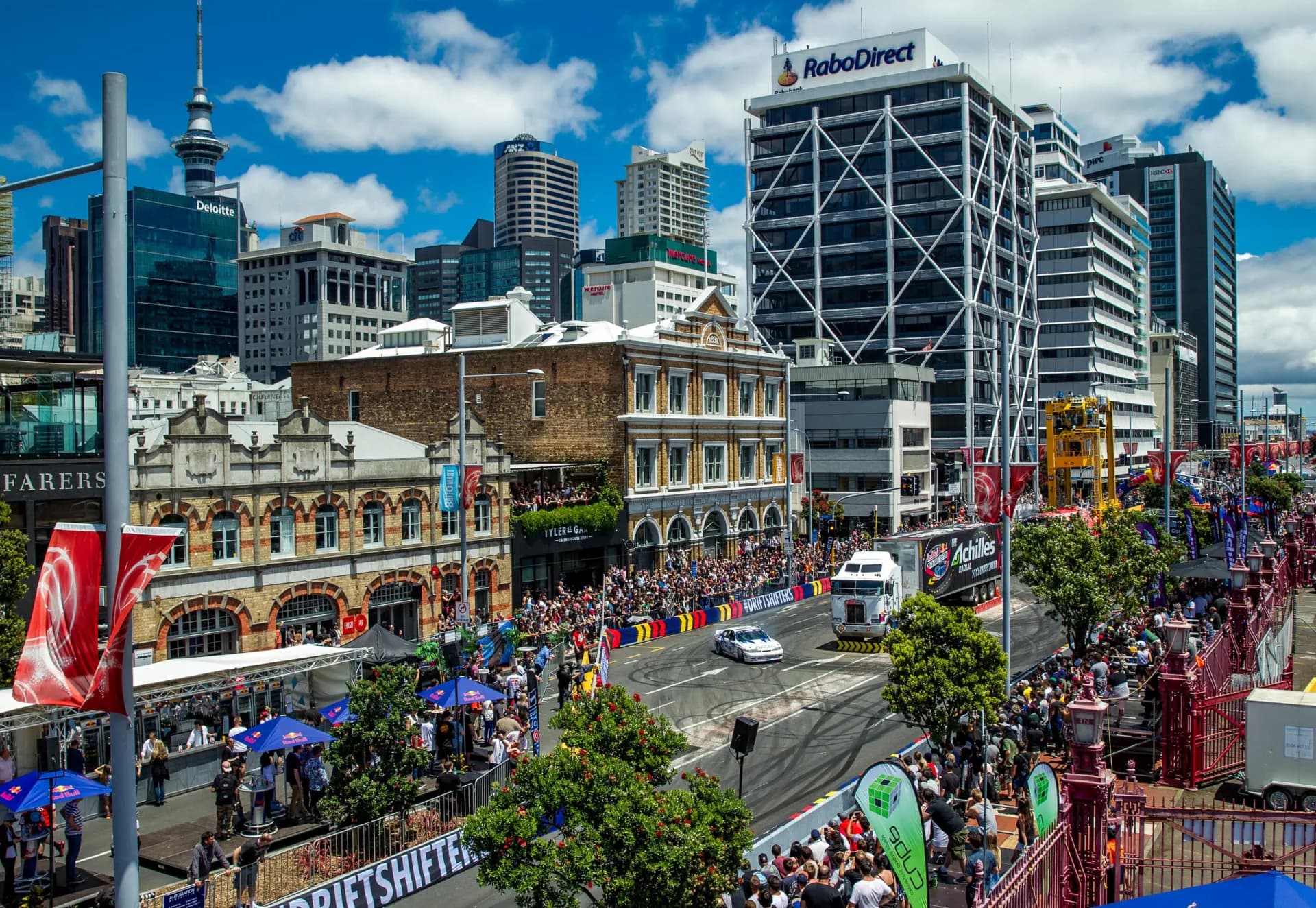 Crowds lining Quay Street, Auckland, for Red Bull Drift Shifters, the Sky Tower behind.