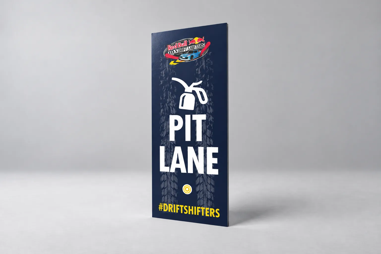 A tall Red Bull Drift Shifters Pit Lane sign.