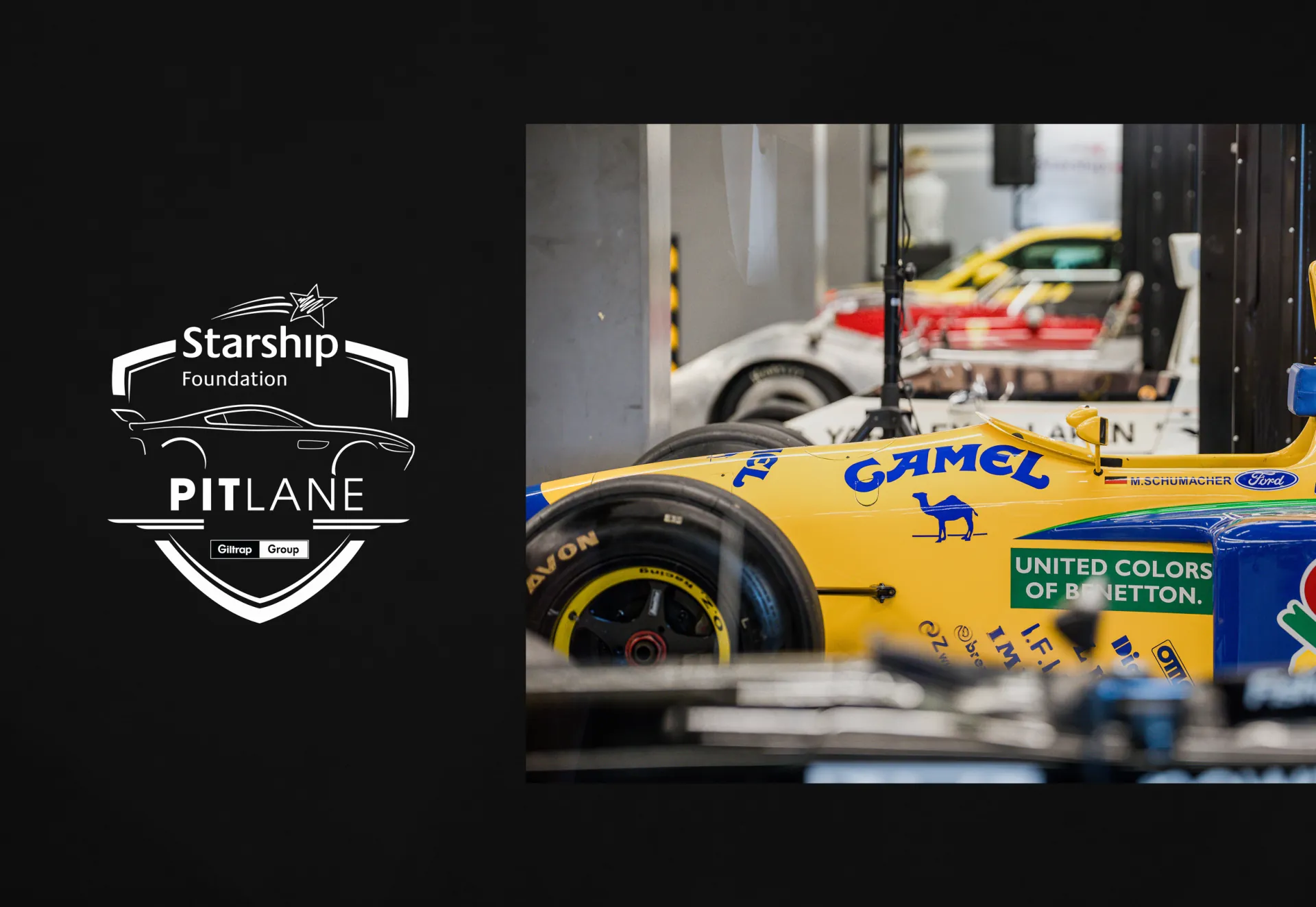The Starship Foundation Pit Lane shield beside a yellow Benetton Formula One car.
