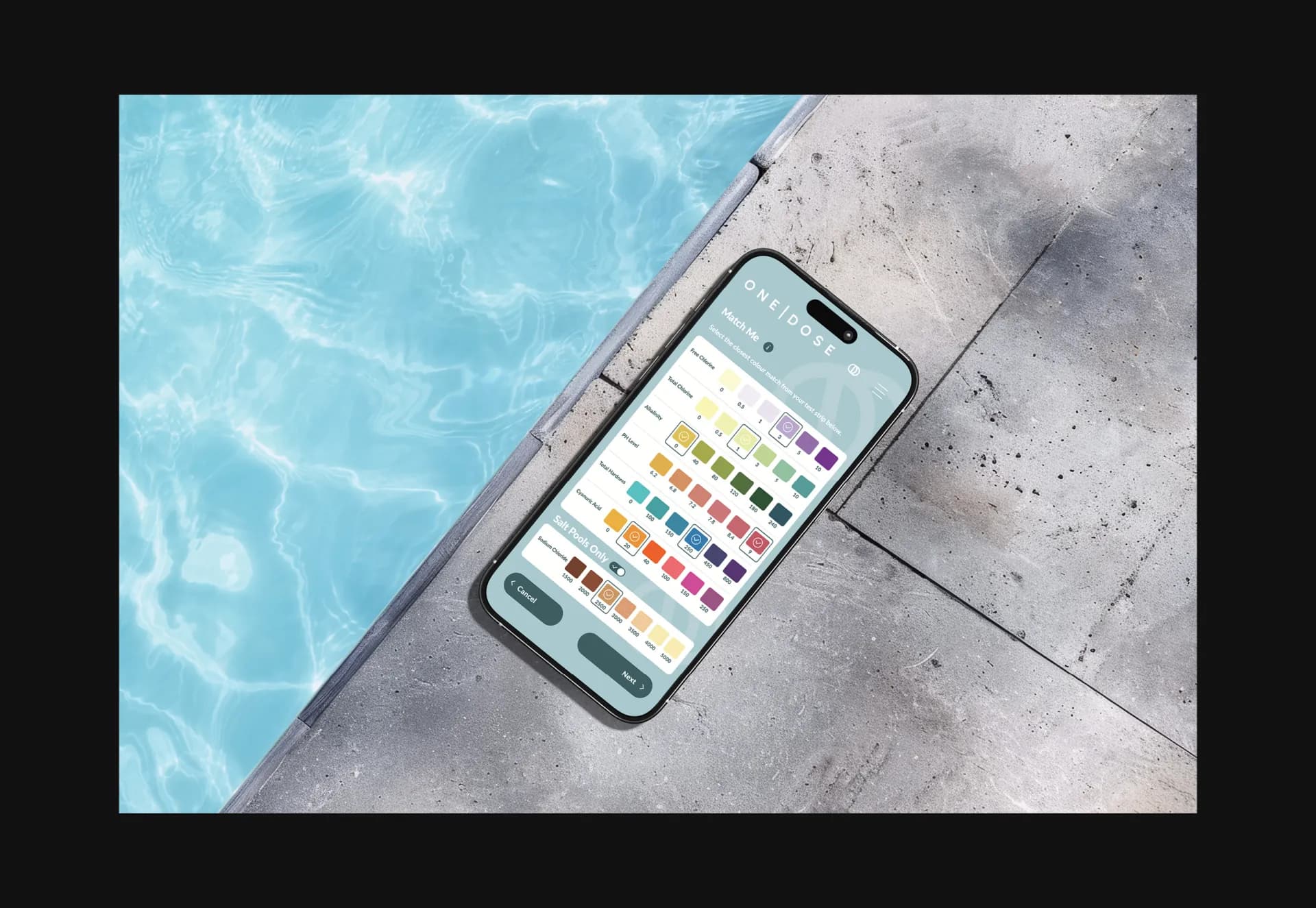The One Dose app’s test-strip colour chart on a phone, lying at the edge of a pool.