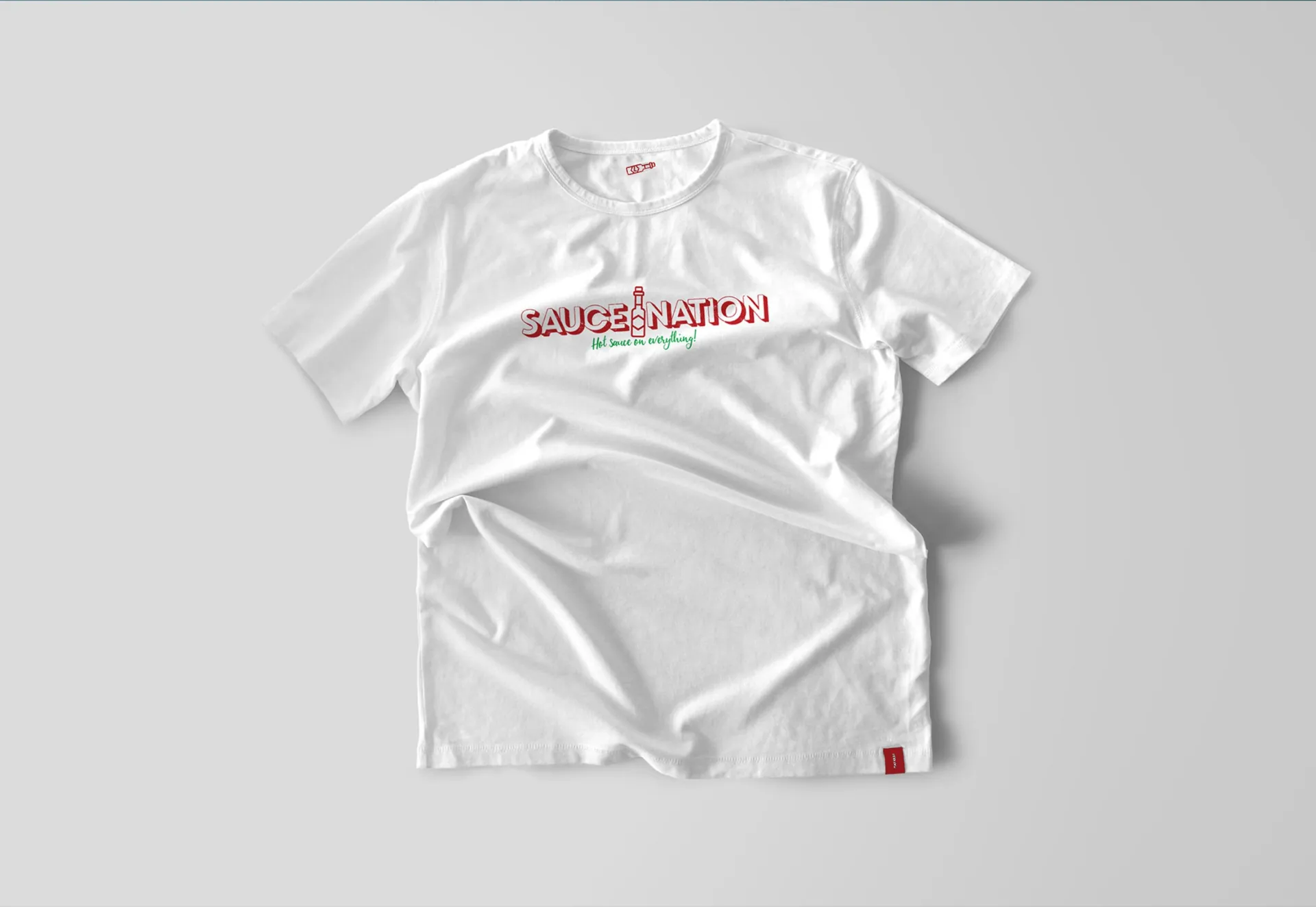A white SauceNation T-shirt.